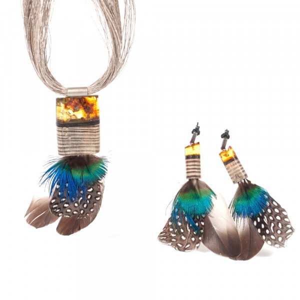 set made of amber, wood, silver and feathers.