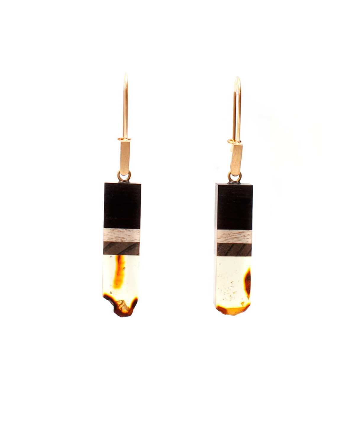 Earrings made of amber and wood on gold plated hooks.