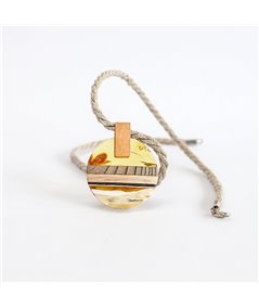 Pendant made of amber and wood on gold plated element.