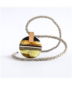 Pendant made of amber and wood on gold plated element.